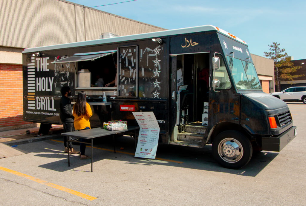 A photo of the Holy Grill food truck during operations.
