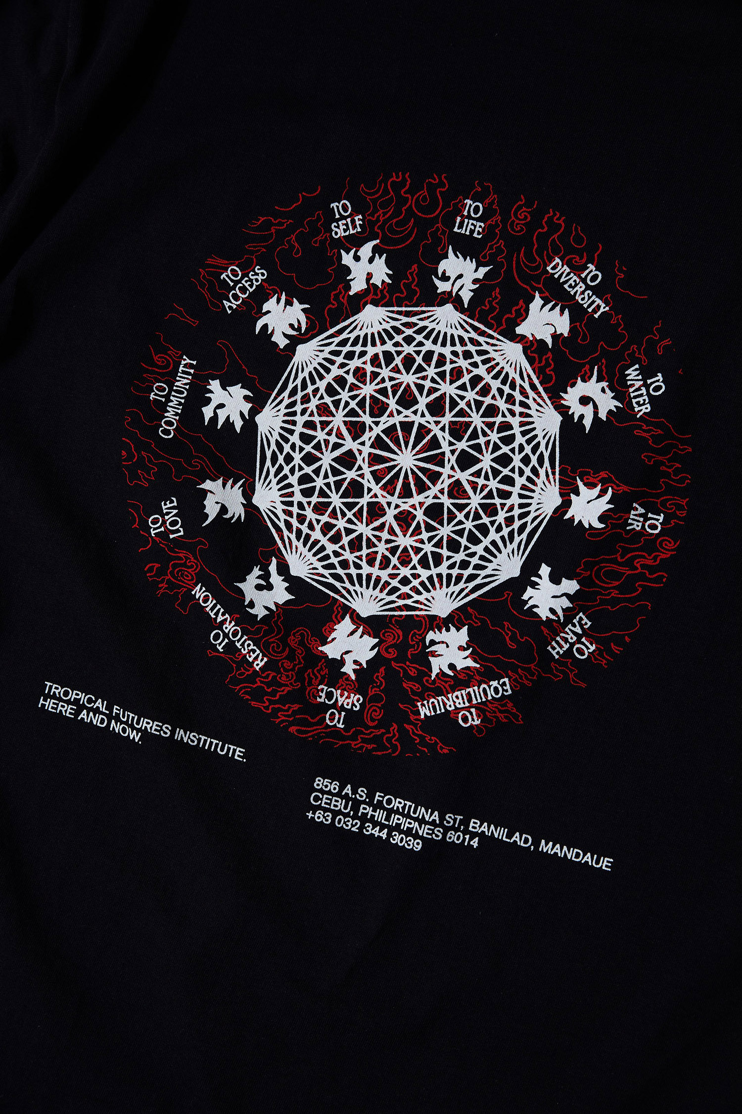 The Here and Now design is a white mandala with points calling out ideals like 