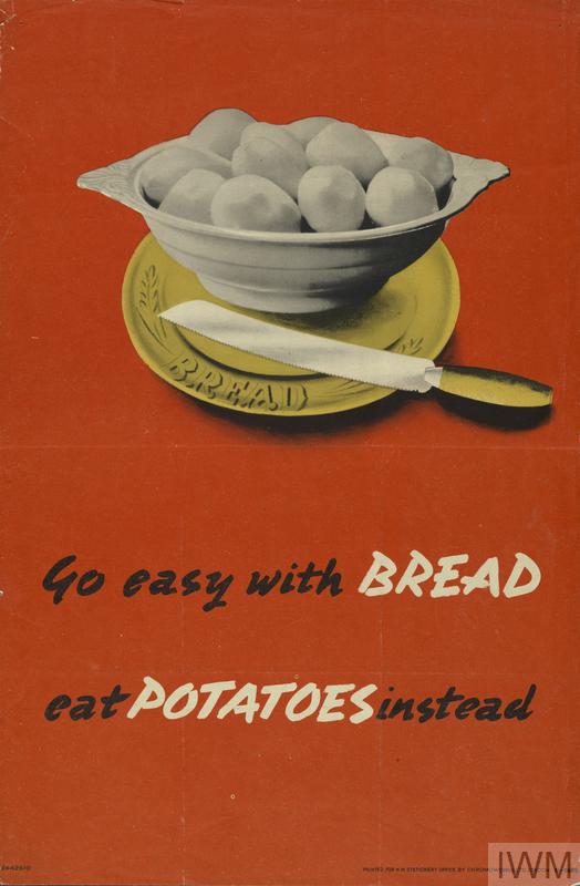 On a orange-red background text reads Go easy with Bread eat Potatoes instead. Bread and Potatoes are highlighted in all capital, white letters. Above the text is a bowl of botatoes sitting atop a bread plate by a butterknife. 