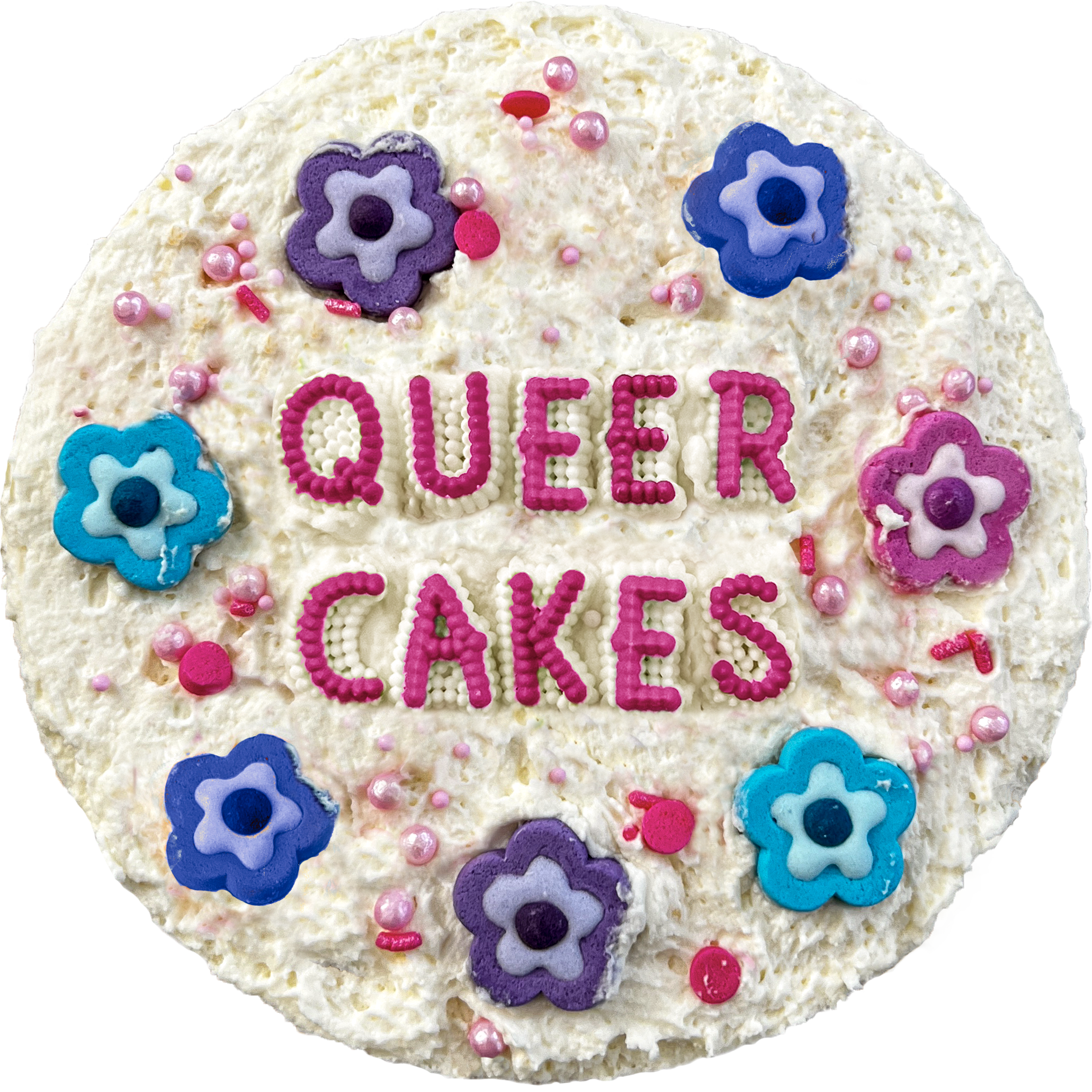A round cake from above with fluffy white icing and candy flowers and letters spelling out queer cakes.