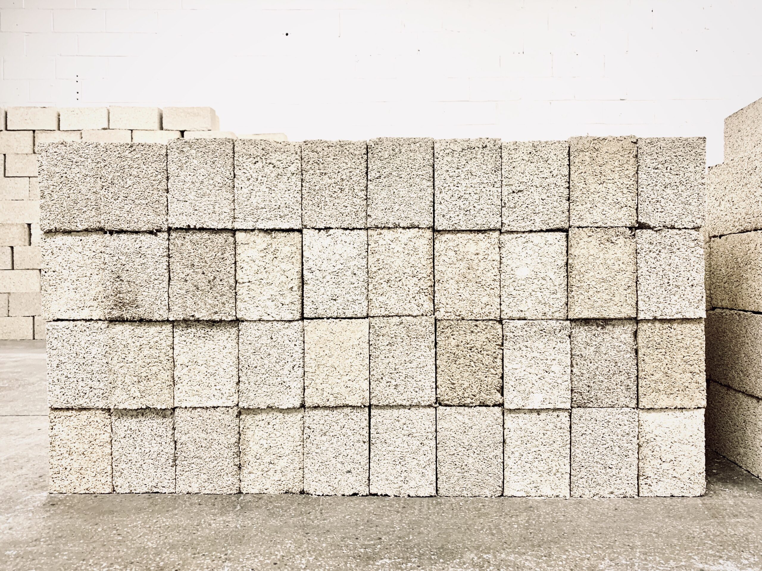 White blocks of concrete-like material stacked in a pile