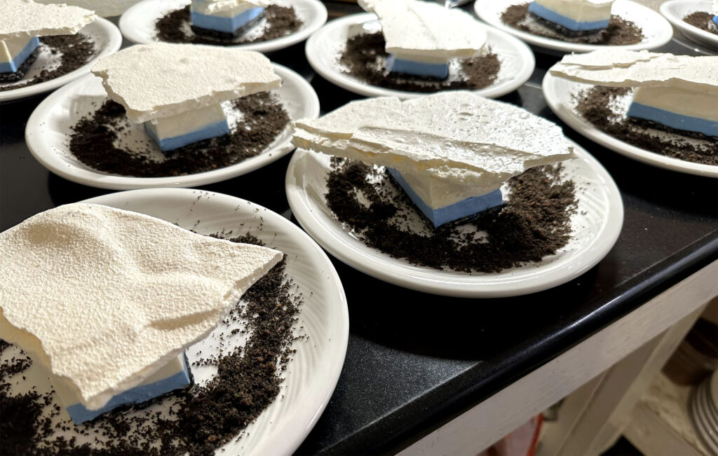 Chocolate cakes layered with shards of white sugar to look like icebergs.