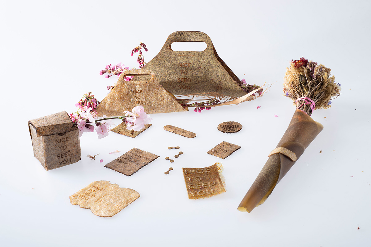 Different packaging samples on a white table.